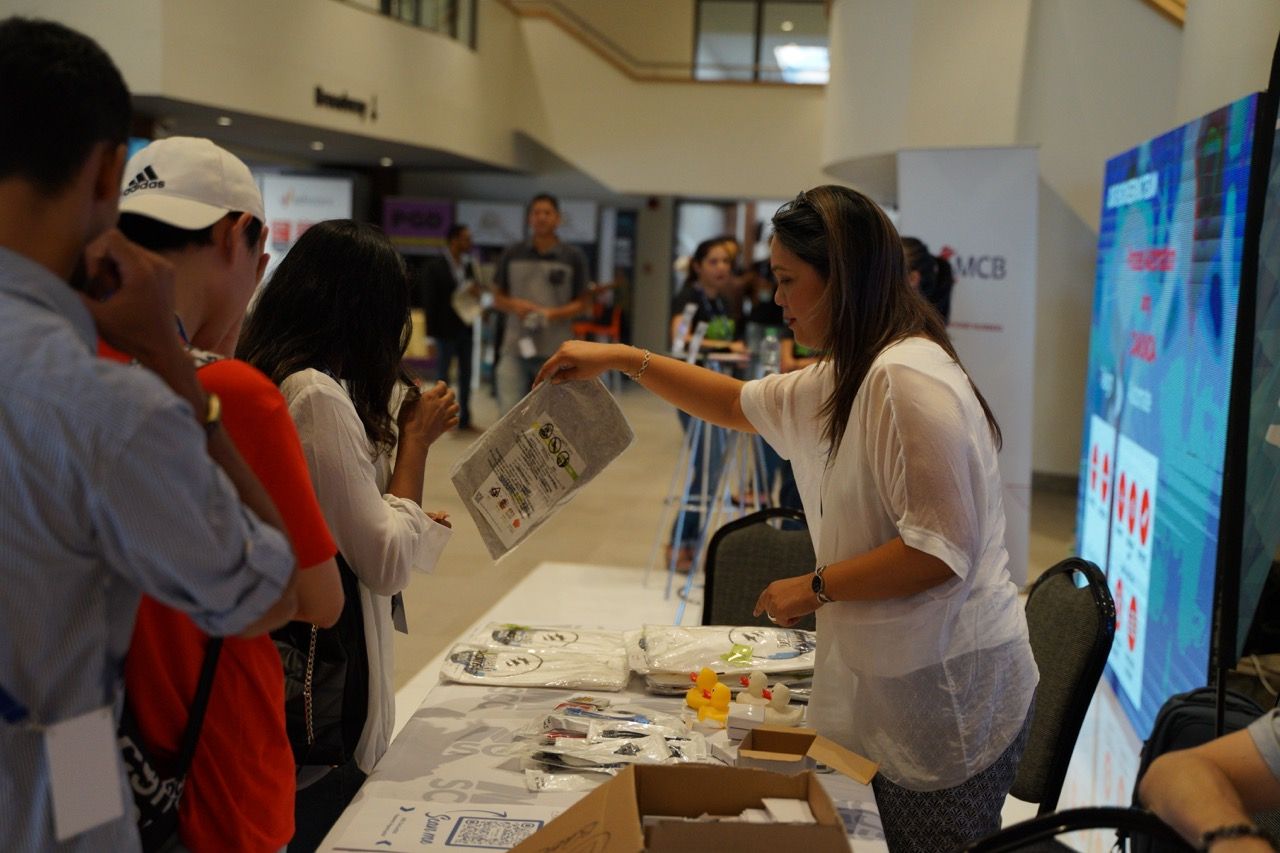 Mary Jane giving out goodies following strict no touching policy, Photo by Arwin Neil Baichoo