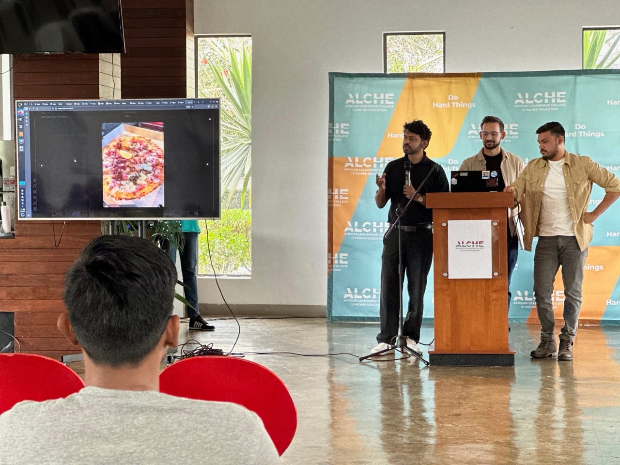 Sandeep, Cedric and Kushul presenting Front-end Coders