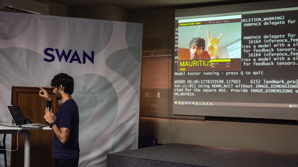 Noor Yadallee doing a live demo of America Sign Language using MediaPipe and Gemini Nano from a Flutter application running from his mobile phone